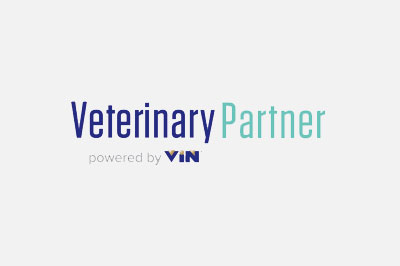 Logo of "veterinary partner" in blue text, followed by "powered by vet" in teal text, on a light gray background.